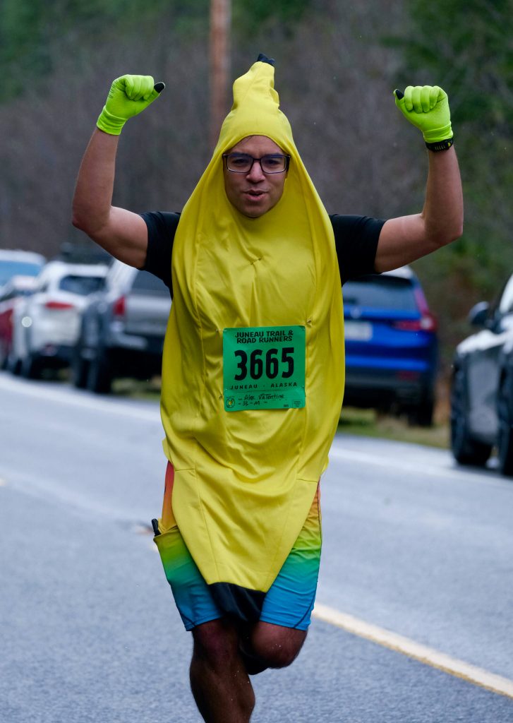 Alex Valentine finishes the Halloween Half Marathon and 5K on Saturday along North Douglas Highway. (Klas Stolpe / Juneau Empire)