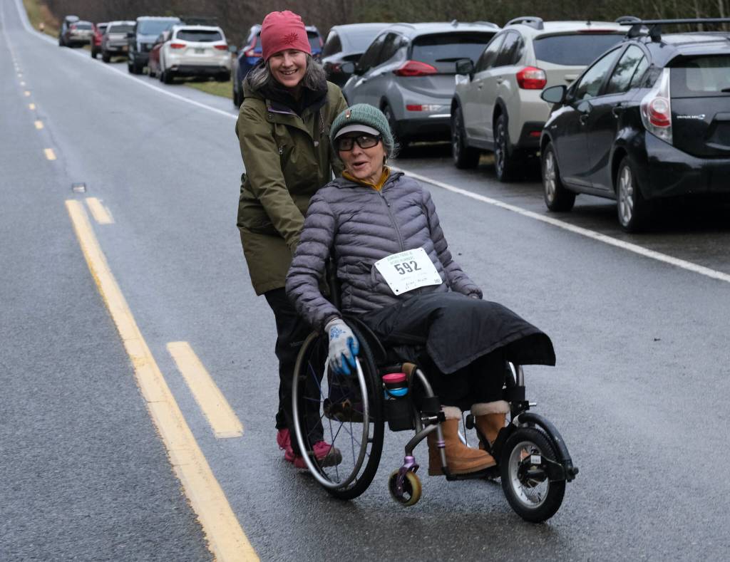 Johanna Crossett and Ellen Pavitt finish the Halloween Half Marathon and 5K on Saturday along North Douglas Highway. (Klas Stolpe / Juneau Empire)