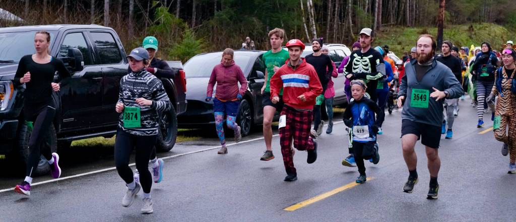 Participants race in the Halloween Half Marathon and 5K on Saturday along North Douglas Highway. (Klas Stolpe / Juneau Empire)