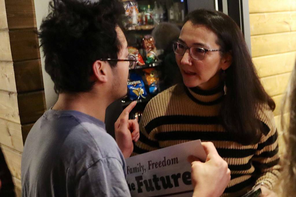 U.S. Rep. Mary Peltola, a Democrat seeking a second full term as Alaskas lone House representative, talks with Fu Bao Hartle, a participant in and spokesperson for local Special Olympics events, during a campaign meet-and-greet on Jan. 27 at the Crystal Saloon. (Mark Sabbatini / Juneau Empire file photo)