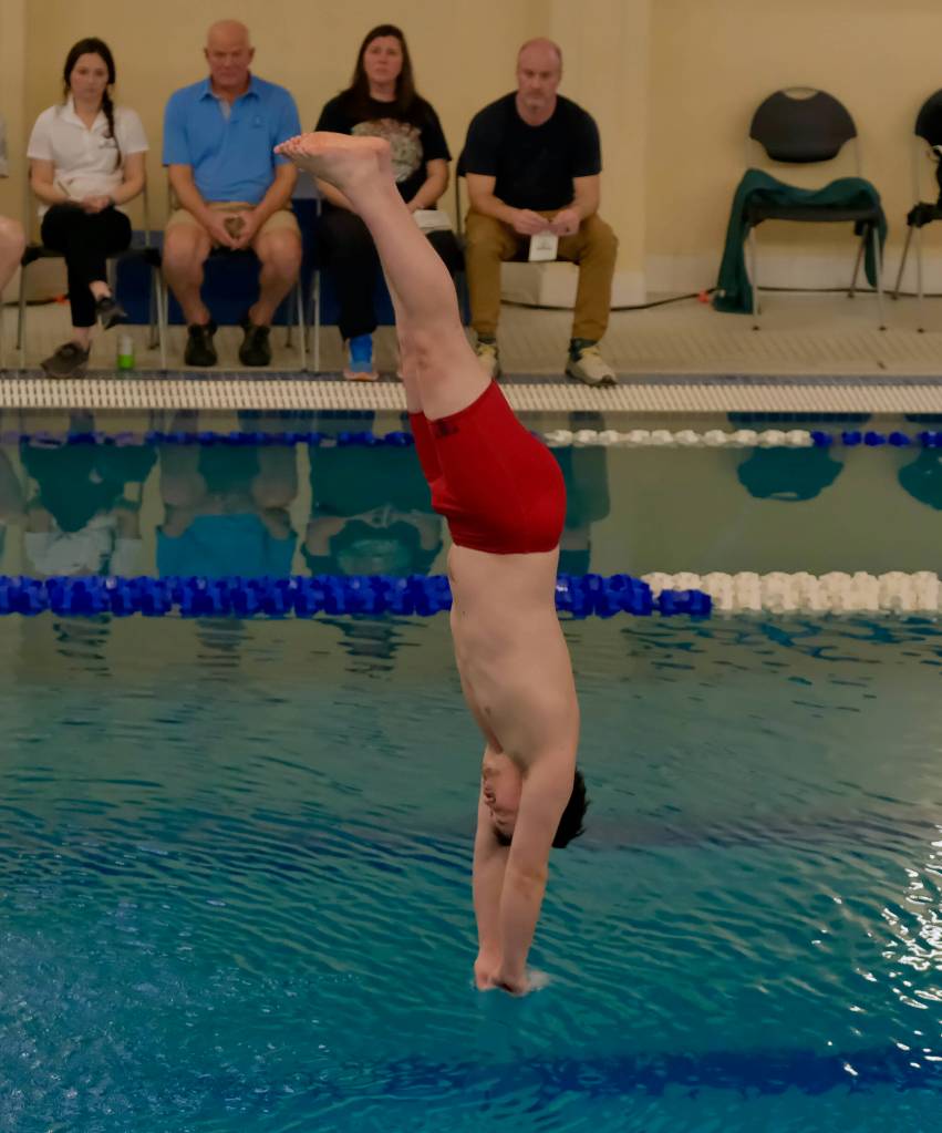 Juneau-Douglas High School: Yadaa.at Kalé senior Paul Smith dives during the 2024 Region V Swim & Dive Championships Saturday at the Petersburg Aquatic Center. (Klas Stolpe / Juneau Empire)