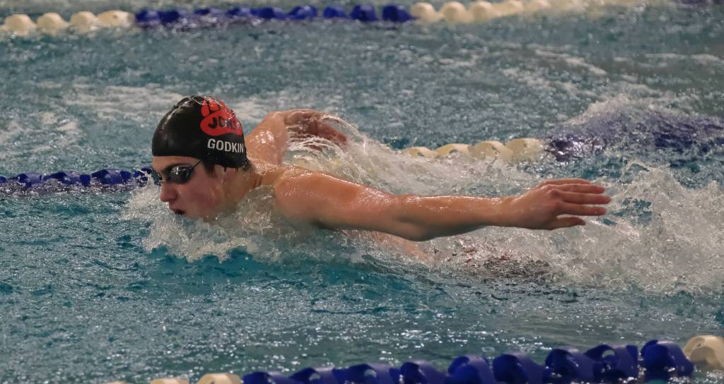 Juneau-Douglas High School: Yadaa.at Kalé senior Matthew Godkin swims the boys 100 yard backstroke during the 2024 Region V Swim & Dive Championships Saturday at the Petersburg Aquatic Center. (Klas Stolpe / Juneau Empire)