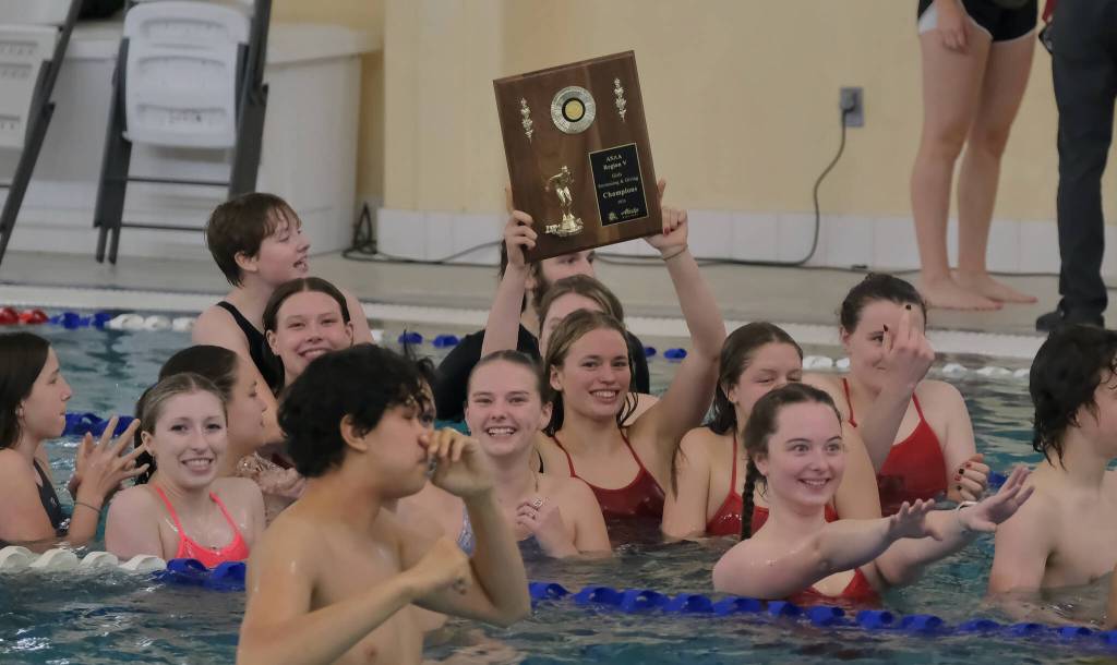 The Juneau-Douglas High School: Yadaa.at Kalé swim and dive team celebrate their weekend at the 2024 Region V Swim & Dive Championships Saturday at the Petersburg Aquatic Center. (Klas Stolpe / Juneau Empire)