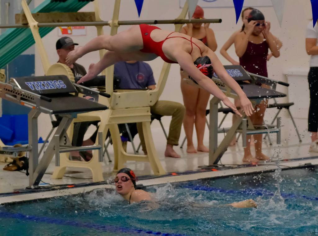 Swimmers start the girls 100 yard breaststroke during the 2024 Region V Swim Dive Championships Saturday at the Petersburg Aquatic Center. (Klas Stolpe / Juneau Empire)