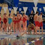 The Juneau-Douglas High School: Yadaa.at Kalé Crimson Bears warm up Friday during the 2024 Region V Swim & Dive Championships at the Petersburg Aquatic Center pool. (Klas Stolpe / Juneau Empire)