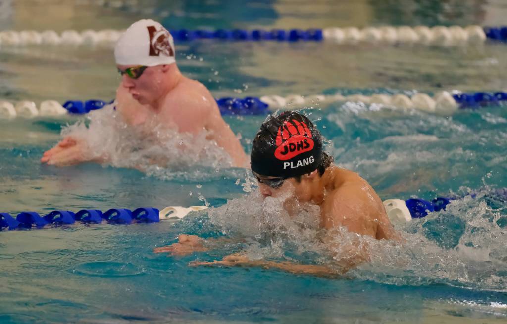 Juneau-Douglas High School: Yadaa.at Kalé senior Matthew Plang and Ketchikans Evan Dash swim the breaststroke leg of the boys 200 medley relay during the 2024 Region V Swim & Dive Championships Saturday at the Petersburg Aquatic Center. (Klas Stolpe / Juneau Empire)