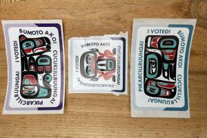 I voted stickers featuring Tlingit artwork by James Johnson are displayed on a table at an early voting station at the Mendenhall Mall annex Oct. 30. (Laurie Craig / Juneau Empire file photo)