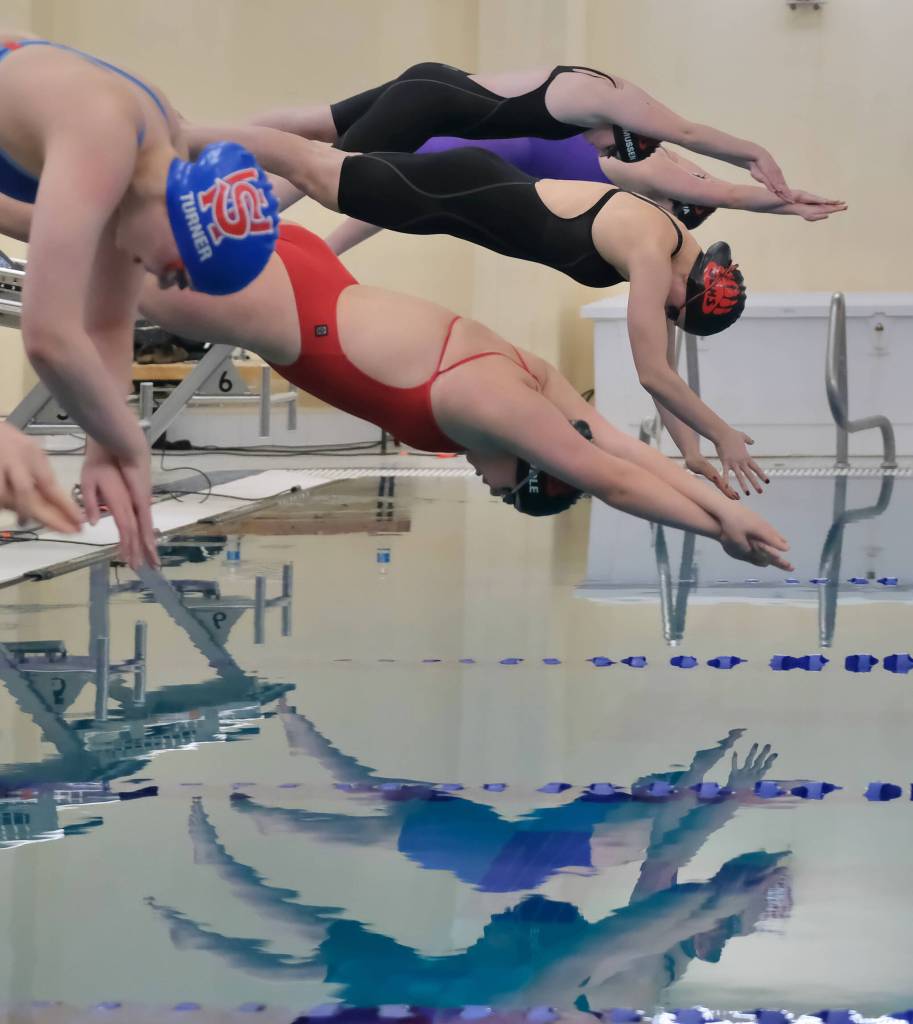 Sitkas Mia Turner and Juneau-Douglas High School: Yadaa.at Kalés Amy Liddle, Racific Ricke, Maddox Rasmussen and Nova Brakes-Hines start the 500 free final at the Region V Championships last weekend in the Petersburg Aquatic Center. (Klas Stolpe / Juneau Empire)