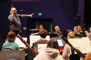 William Todd Hunt guides the Taku Winds ensemble through a rehearsal of music by Indigenous composers on Tuesday evening at Thunder Mountain Middle School. (Mark Sabbatini / Juneau Empire)