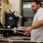 Percussionist Ed Littlefield prepares to strike a timpani during rehearsals for Juneau Symphonys Holiday Cheer concert in December of 2022. He will perform in a Taku Winds concert on Saturday at Thunder Mountain Middle School. (Ben Hohenstatt / Juneau Empire file photo)