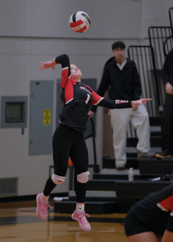 Juneau-Douglas High School: Yadaa.at Kalé sophomore June Troxel serves during the Crimson Bears 20-25, 25-9, 25-11, 25-18 match win over Ketchikan on Friday during the Region V Volleyball Championships at Juneaus George Houston Gymnasium. (Klas Stolpe / Juneau Empire)
