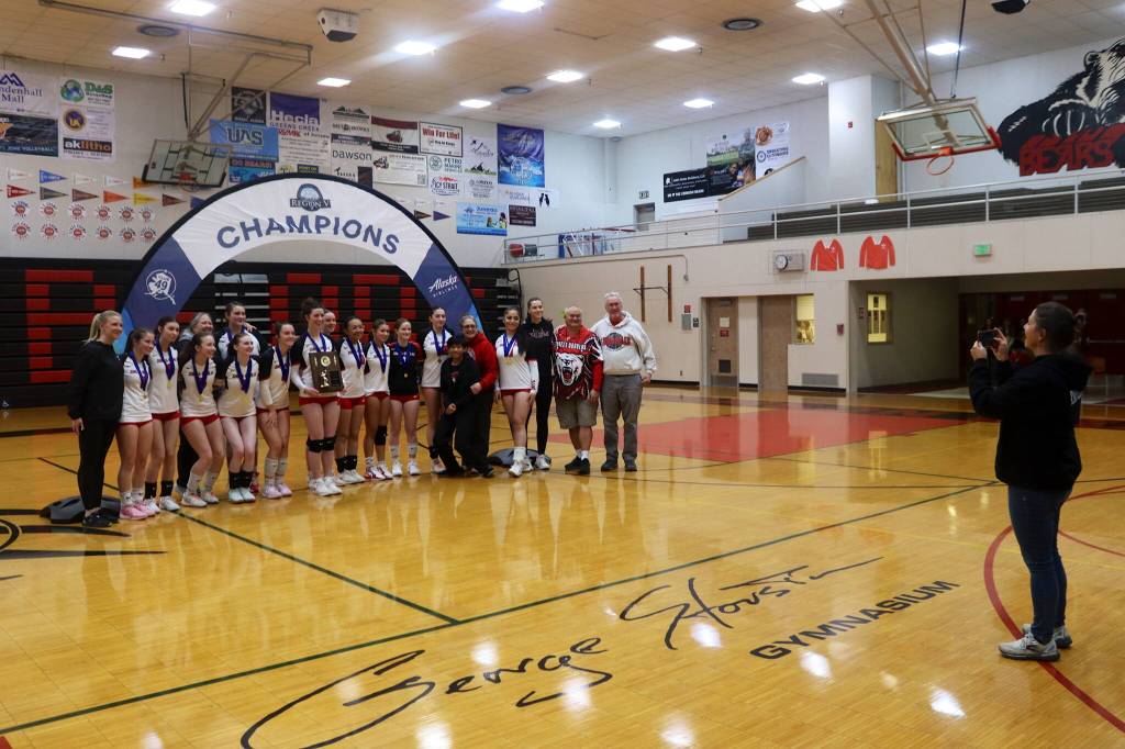 Juneau-Douglas High School: Yadaa.at Kalé volleyball players and coaches pose for a team shot after winning the Region V championship against Ketchikan High School on Saturday at JDHS. (Mark Sabbatini / Juneau Empire)