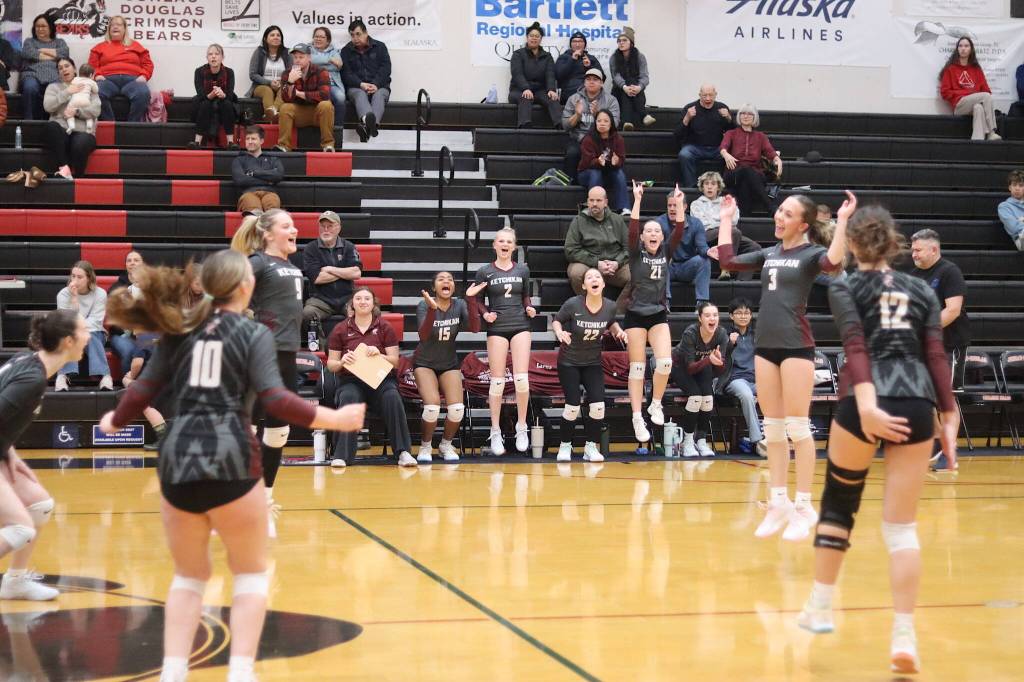 Ketchikan High School celebrates winning the third set of Saturdays Region V tournament game after losing the first two sets to Juneau-Douglas High School: Yadaa.at Kalé to JDHS. (Mark Sabbatini / Juneau Empire)