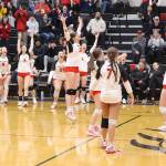 The Juneau-Douglas High School: Yadaa.at Kalé volleyball team celebrates scoring the winning point in Saturdays game against Ketchikan High School at JDHS to win the Region V title and advance to the state tournament next week. (Mark Sabbatini / Juneau Empire)