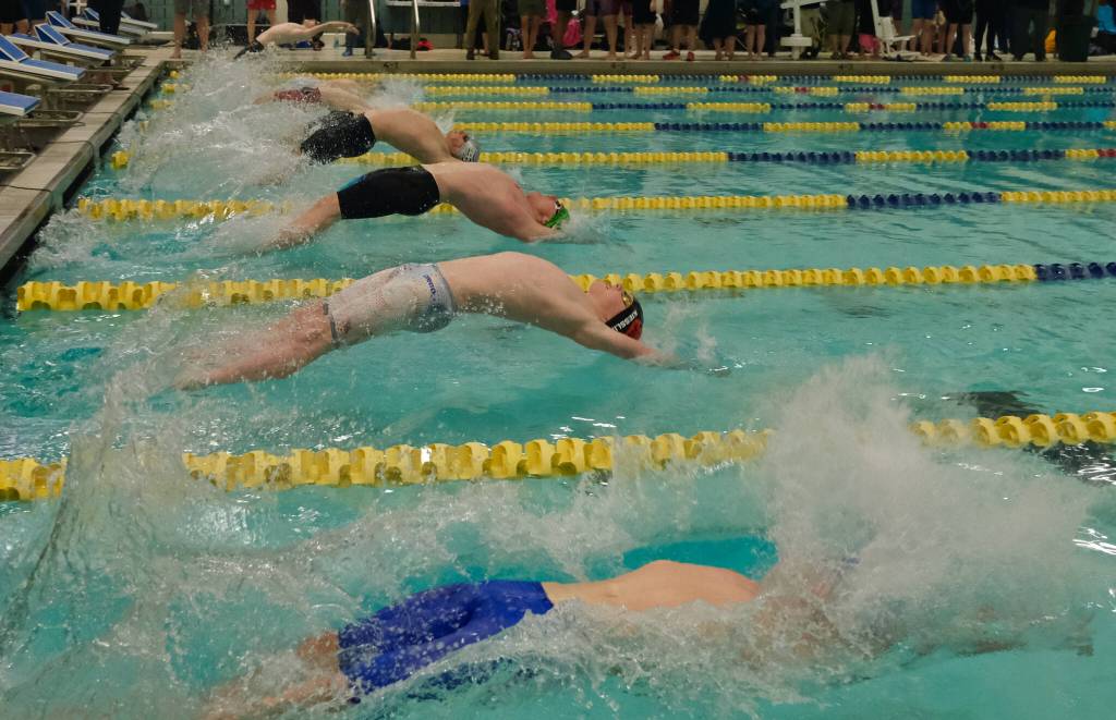 Juneau-Douglas High School: Yadaa.at Kalé freshman Liam Kiessling starts the boys 200 yard medley relay final during the ASAA Swim & Dive State Championships on Saturday at Anchorages Bartlett High School pool. (Klas Stolpe / Juneau Empire) 4Swim4 -
