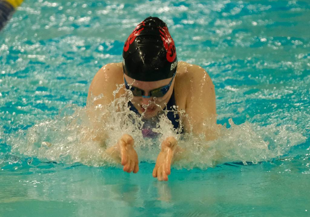 Juneau-Douglas High School: Yadaa.at Kalé senior Parker Boman swims the girls 100 yard breaststroke final during the ASAA Swim & Dive State Championships on Saturday at Anchorages Bartlett High School pool. (Klas Stolpe / Juneau Empire)