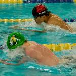 Juneau-Douglas High School: Yadaa.at Kalé senior Matthew Plang pushes Service senior Jan Beck to the finish of the boys 100 yard breaststroke final during the ASAA Swim & Dive State Championships on Saturday at Anchorages Bartlett High School pool. (Klas Stolpe / Juneau Empire)