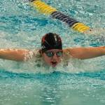 Juneau-Douglas High School: Yadaa.at Kalé senior Lucia Chapell swims in the girls 100 fly final during the ASAA Swim & Dive State Championships on Saturday at Anchorages Bartlett High School pool. (Klas Stolpe / Juneau Empire)