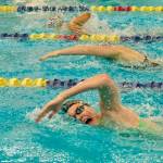 Juneau-Douglas High School: Yadaa.at Kalé junior Deedee Mills (bottom) chases Eagle River junior Sophia Trembath (middle) and Eagle River senior Lola Woodward (top) to the finish of the girls 100 free final during the ASAA Swim & Dive State Championships on Saturday at Anchorages Bartlett High School pool. (Klas Stolpe / Juneau Empire)