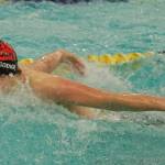 Juneau-Douglas High School: Yadaa.at Kalé senior Mathew Godkin swims the fly leg of the boys 200 yard medley relay final during the ASAA Swim & Dive State Championships on Saturday at Anchorages Bartlett High School pool. (Klas Stolpe / Juneau Empire)