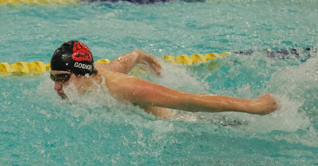 Juneau-Douglas High School: Yadaa.at Kalé senior Mathew Godkin swims the fly leg of the boys 200 yard medley relay final during the ASAA Swim & Dive State Championships on Saturday at Anchorages Bartlett High School pool. (Klas Stolpe / Juneau Empire)