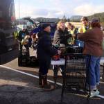 Members of the Juneau Central Labor Council food drive and volunteers sort items during a food drive Saturday at Super Bear IGA Supermarket. (Mark Sabbatini / Juneau Empire)