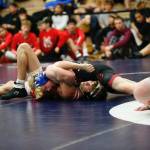 Juneau Douglass Colton Cummins pins Wrangells Copper Powers during the Bill Weiss Wrestling Tournament at the Clarke Cochrane Gymnasium at Ketchikan High School on Friday. (Christopher Mullen / Ketchikan Daily News)