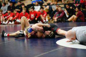 Juneau Douglass Colton Cummins pins Wrangells Copper Powers during the Bill Weiss Wrestling Tournament at the Clarke Cochrane Gymnasium at Ketchikan High School on Friday. (Christopher Mullen / Ketchikan Daily News)