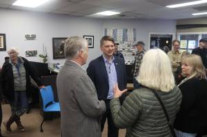 Nick Begich, center, the Republican candidate for Alaskas lone U.S. House seat, talks with supporters during a meet-and-greet Oct. 12 at the Southeast Alaska Real Estate office near the Nugget Mall. (Mark Sabbatini / Juneau Empire file photo)