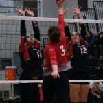 Juneau-Douglas High School: Yadaa.at Kalé juniors Lavinia Maake (11) and Neela Thomas (12) defend Wasilla junior Mia Caldwell (3) in a game earlier this season. Maake was chosen player of the game on Thursday in the Crimson Bears opening loss to Service in the 2024 ASAA Volleyball State Championships at Anchorages Alaska Airlines Center. (Klas Stolpe / Juneau Empire file photo)