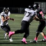 Juneau junior Ricky Tupou (77) opens a hole for senior Jayden Johnson during a state playoff game this season at West Anchorage. Tupou was selected an All-State offensive lineman. (Klas Stolpe / Juneau Empire file photo)