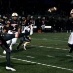 Juneau senior Johnathyn Kestel (32) punts during the state playoff game at West Anchorage this season. Kestel was selected an All-State punter. (Klas Stolpe / Juneau Empire file photo)