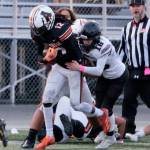 Juneau senior Caleb Ziegenfuss (16) tackles West Anchorage junior Talon Copeland (12) during the state playoffs at West Anchorage. Ziegenfuss was selected an All-State outside linebacker. (Klas Stolpe / Juneau Empire file photo)