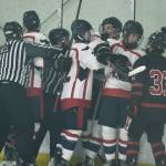 Referees break up a hockey melee during the Crimson Bears 5-2 loss to the Patriots on Saturday at the Treadwell Ice Arena. (Klas Stolpe / Juneau Empire)