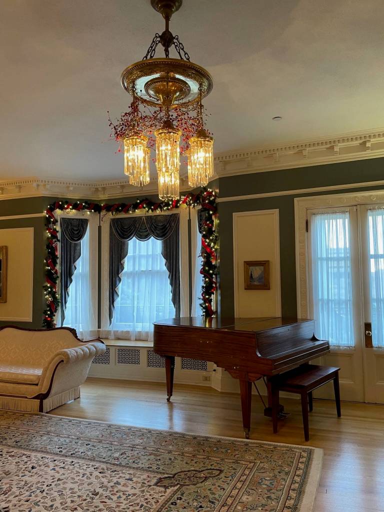 The Hardman piano, purchased for $500 in 1912, remains in the homes ballroom, also known as the music room. (Laurie Craig / Juneau Empire)