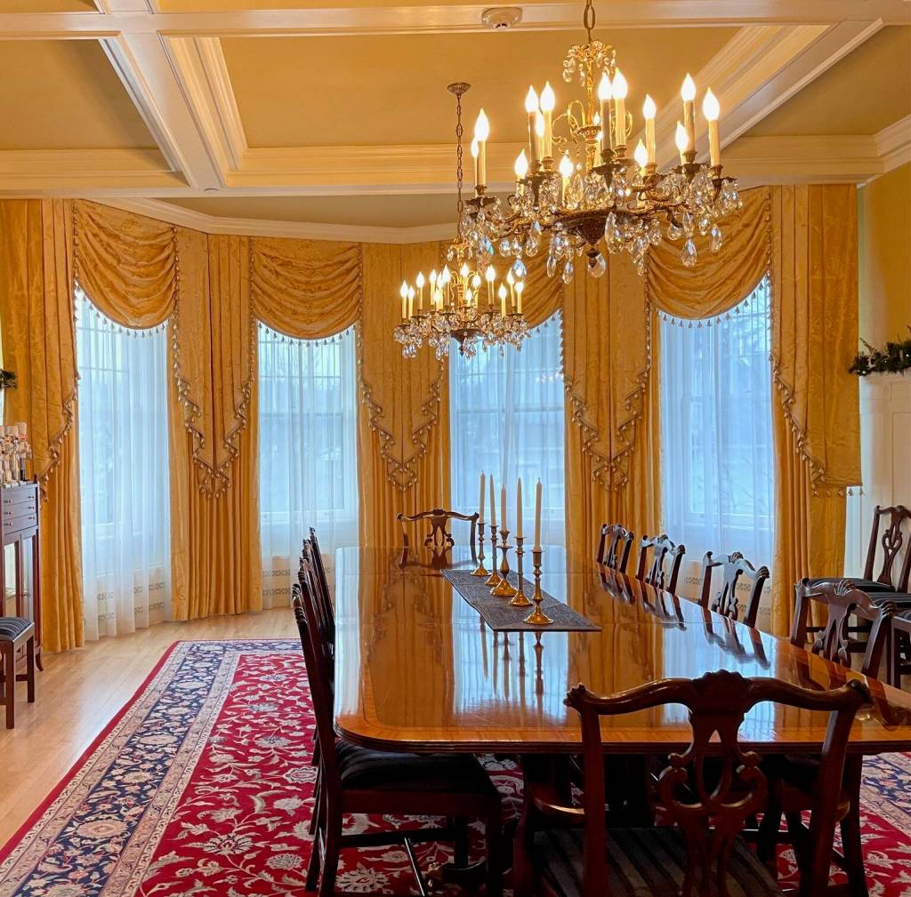 Elegant draperies accentuate the bay windows in the dining room. The window treatment and coffered ceiling were added during Gov. Sean Parnells terms. (Laurie Craig / Juneau Empire)