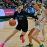 Current senior Kerra Baxter (22) dribbles for now defunct Thunder Mountain High School in last seasons ASAA state championship semifinal game against the Colony Knights Morgan Ainsworth (12). Baxter has signed to play Division II college basketball with the University of Alaska Anchorage Seawolves. She will play for Juneau-Douglas High School: Yadaa.at Kalé this year. (Klas Stolpe / Juneau Empire)