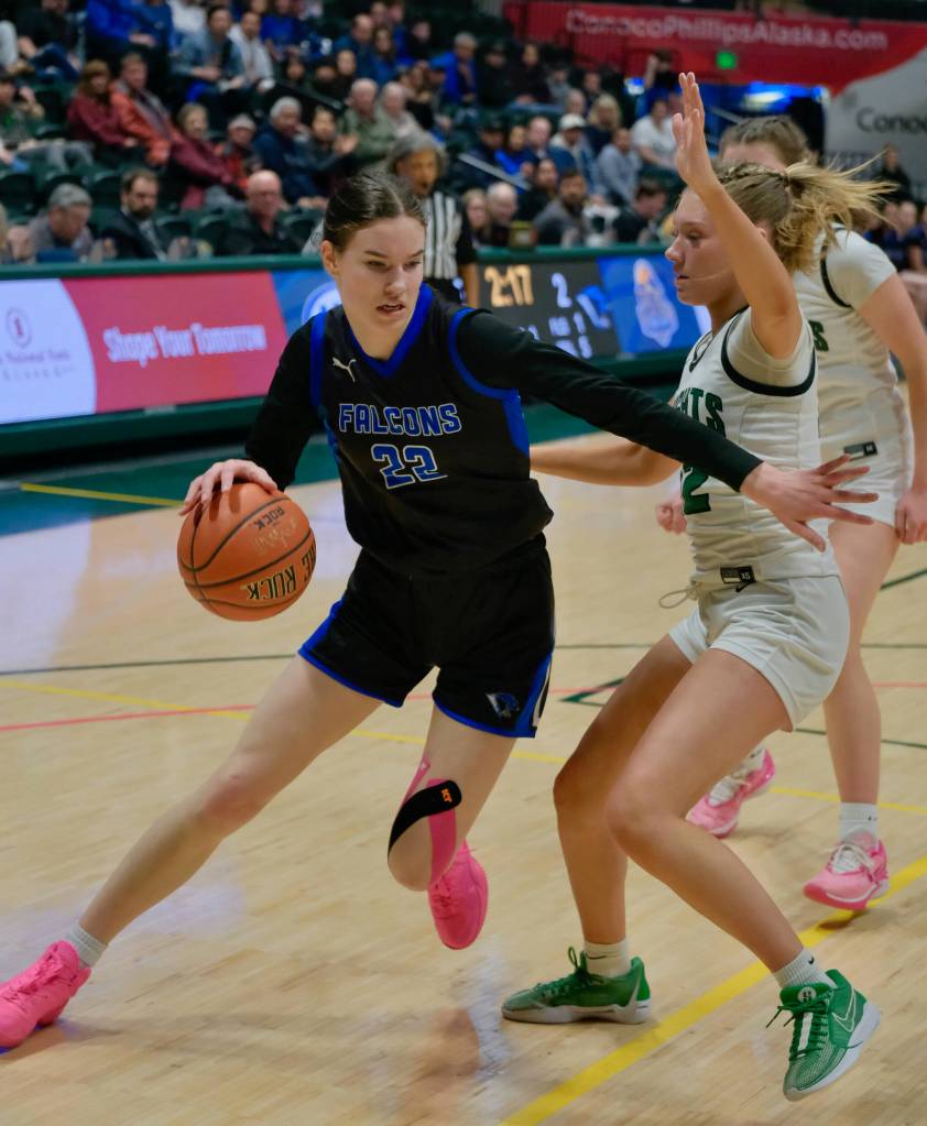 Current senior Kerra Baxter (22) dribbles for now defunct Thunder Mountain High School in last seasons ASAA state championship semifinal game against the Colony Knights Morgan Ainsworth (12). Baxter has signed to play Division II college basketball with the University of Alaska Anchorage Seawolves. She will play for Juneau-Douglas High School: Yadaa.at Kalé this year. (Klas Stolpe / Juneau Empire)