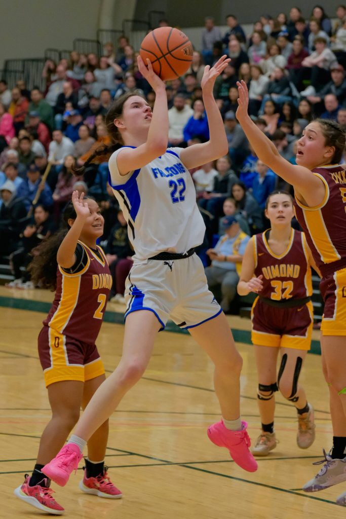 Current senior Kerra Baxter (22) scores for now defunct Thunder Mountain High School in last seasons ASAA state championship quarterfinal against the Dimond Lynx. Baxter has signed to play Division II college basketball with the University of Alaska Anchorage Seawolves. She will play for Juneau-Douglas High School: Yadaa.at Kalé this year. (Klas Stolpe / Juneau Empire)