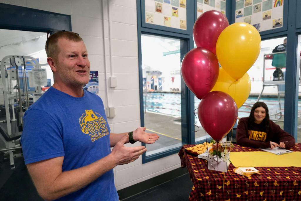 GSC swim coach Scott Griffith speaks during Juneau-Douglas High School: Yadaa.at Kalé senior Emma Fellmans letter of intent signing to the University of Minnesota on Thursday at Augustus Brown Pool. (Klas Stolpe / Juneau Empire)