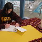Juneau-Douglas High School: Yadaa.at Kalé senior Emma Fellman signs a national letter of intent on Thursday at Augustus Brown Pool to attend and swim for the University of Minnesota. (Klas Stolpe / Juneau Empire)