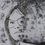 An depiction of artist Blake Byers girlfriend, Alyssa James, is seen on a grass surface covered with snow in Oregon. Byers says he created the image using a garden sprayer. (Photo by Blake Byers)