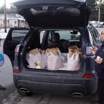 Larry Gamez and Rachel Ceja collect items for a Thanksgiving food basket to deliver to a house in the Mendenhall Valley on Saturday morning as part of St. Vincent de Pauls annual distribution program. (Mark Sabbatini / Juneau Empire)