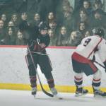 Juneau-Douglas High School: Yadaa.at Kalé junior Elliot Welch (36) moves a puck past a North Pole player in action earlier this season at Treadwell Ice Arena. Welch had two goals against the Palmer Moose on Friday at Palmer. (Klas Stolpe / Juneau Empire file photo)
