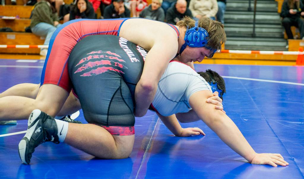 Sitka High Schools Dylan Peterson wrestles Juneau-Douglas High School: Yadaa.at Kalé junior Richard Tupou in the 285-pound weight division Friday at the Sitka Invitational. (James Poulson / The Daily Sitka Sentinel)