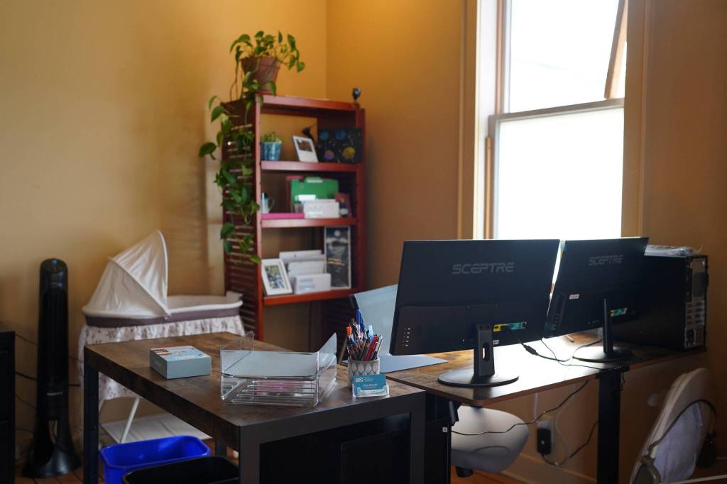 Executive Director Eliza Russells desk within the Skagway Development Corporations Small Business Resource Center, prepped for the arrival of her daughter Sage. (Photo by Shaelene Grace Moler)