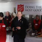 Petr Janousek (center), co-leader of The Salvation Army Juneau Corps, says grace before the organizations annual communal Thanksgiving Day at the Juneau Yacht Club. (Mark Sabbatini / Juneau Empire)