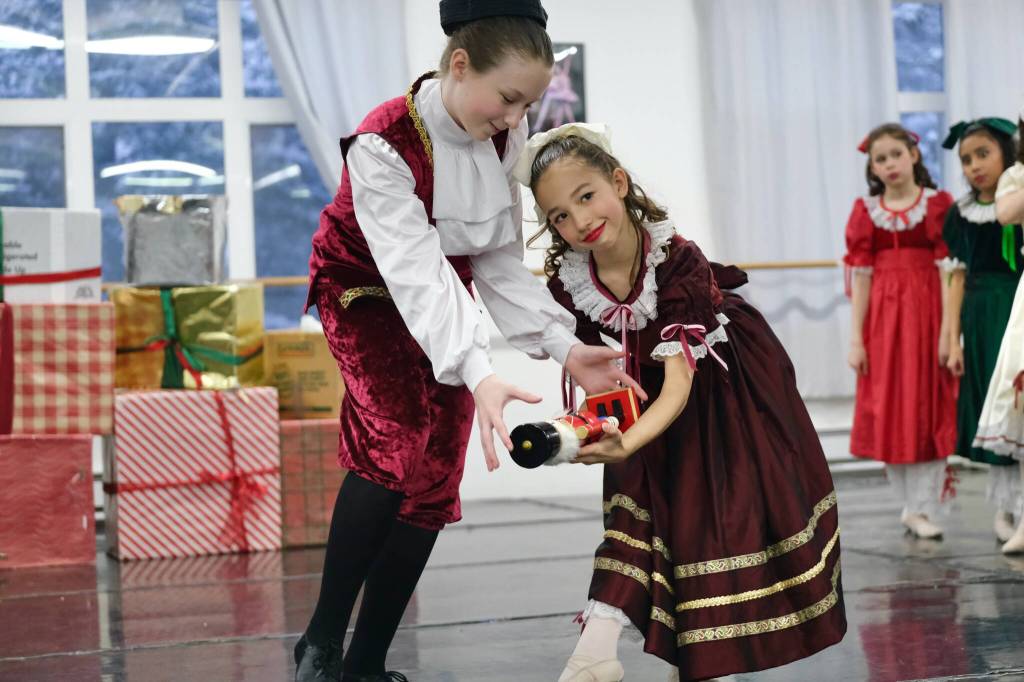 Fritz, played by Dani Hayes, steals the Nutcracker doll from Clara, played by Sachiko Marks, in Juneau Dance Theatres production of The Nutcracker during dress rehearsal Sunday at the JDT studio. (Klas Stolpe / Juneau Empire)