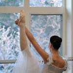 In this 2009 photo, Decembers mid-day light shines through the Juneau Dance Unlimited studio as Misha Culver stretches in her Snow costume during a dress rehearsal for The Nutcracker. (Klas Stolpe)