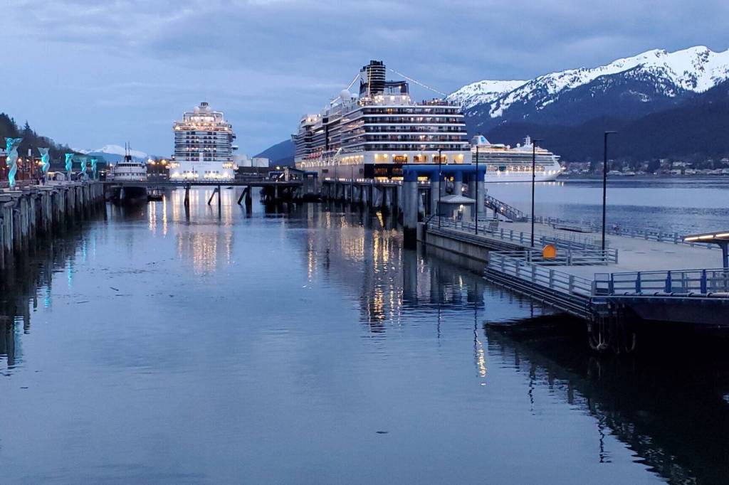 Three cruise ships are docked along Juneaus waterfront on the evening on May 10, 2023, as a Princess cruise ship on the right is departing the capital city. A banner year for tourism in 2023, when a record 1.65 million cruise passengers visited the state, lifted workers average wages in the Southeast region, the state Department of Labor and Workforce Development reported. (Yereth Rosen/Alaska Beacon)